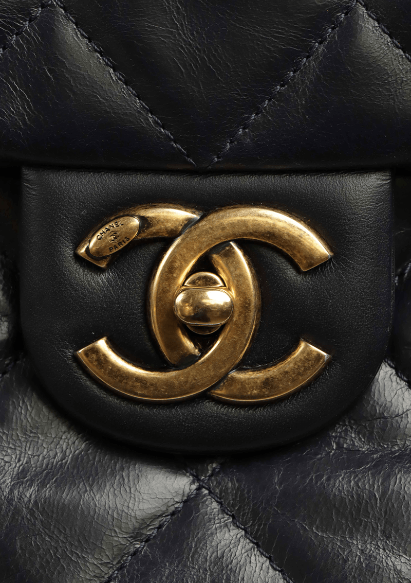 Chanel bag with gold bar on top hotsell