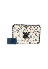 LIMITED EDITION TWIST GRAPHIC PRINT WALLET MM