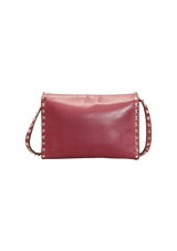 MEDIUM ROCKSTUD FLIPLOCK CROSSBODY BAG