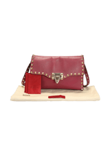 MEDIUM ROCKSTUD FLIPLOCK CROSSBODY BAG