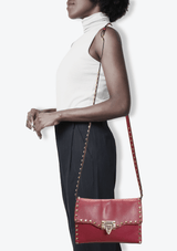 MEDIUM ROCKSTUD FLIPLOCK CROSSBODY BAG