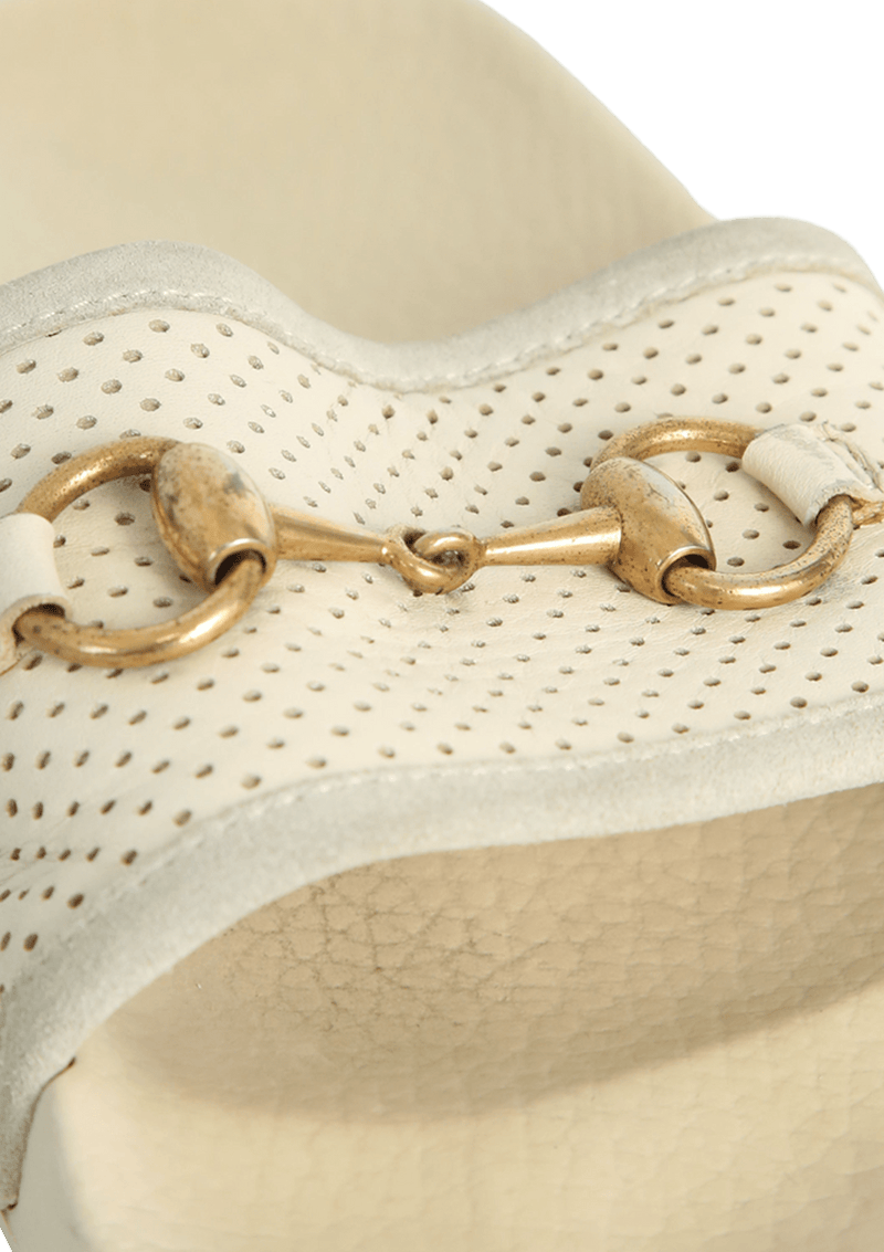 Horsebit slides top