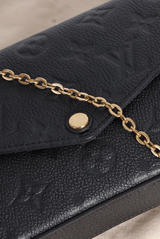 MONOGRAM EMPREINTE POCHETTE FÉLICIE