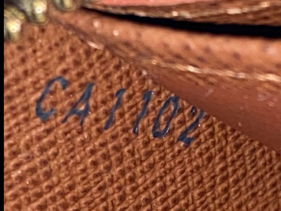 MONOGRAM ZIPPY WALLET