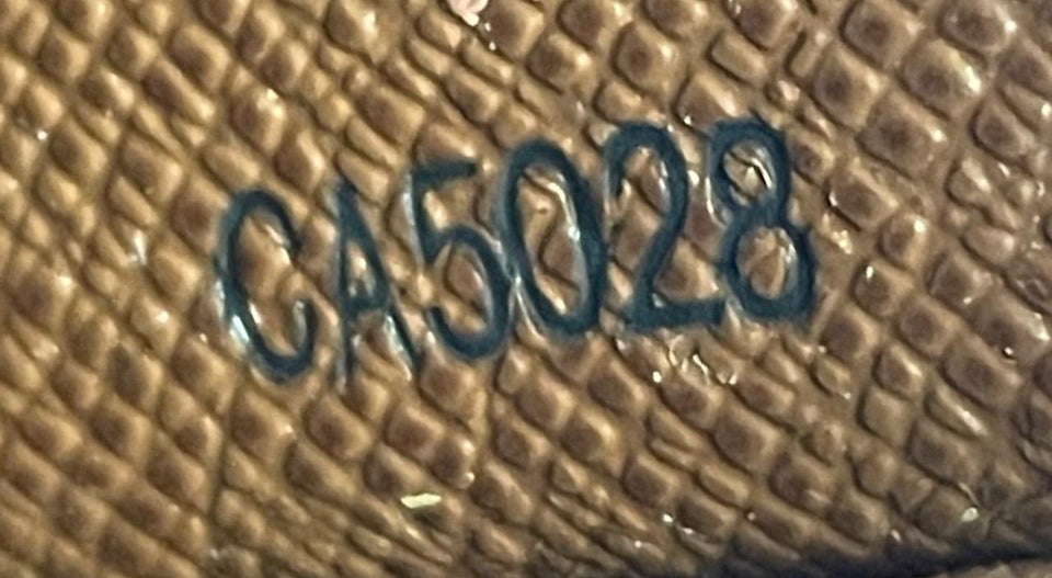 MONOGRAM ZIPPY WALLET