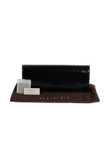 PATENT MICROGUCCISSIMA SMALL BROADWAY CLUTCH