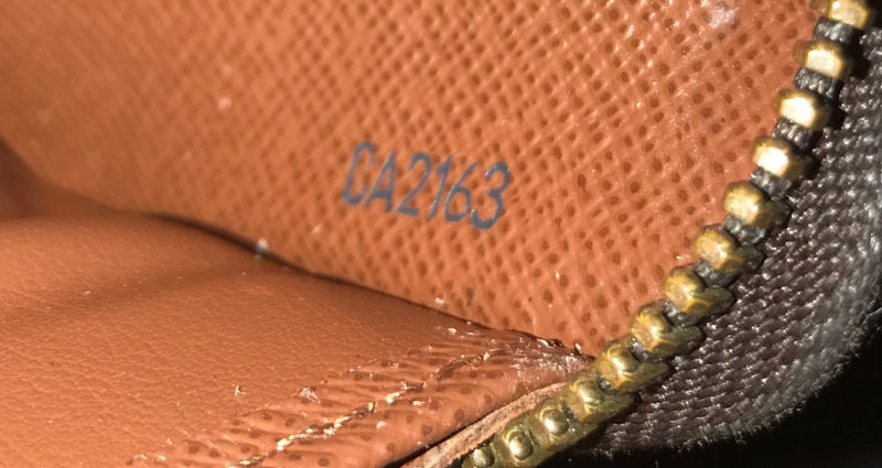 MONOGRAM ZIPPY WALLET